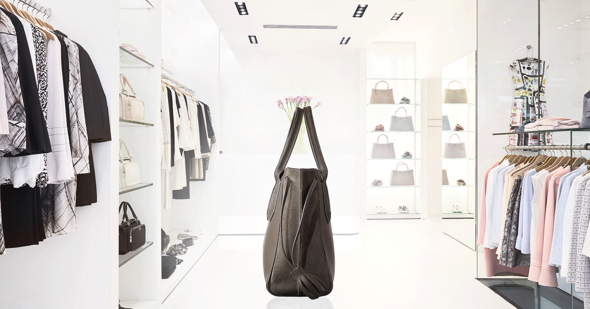 3D spinning handbag with fashion store background.