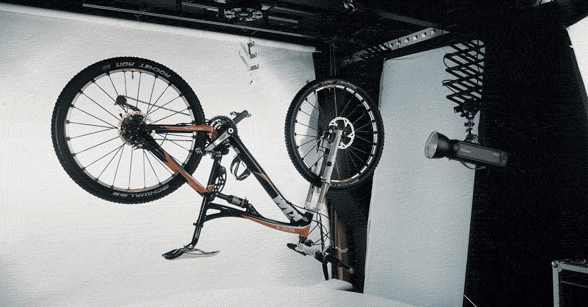 Suspending bicycle upside-down for spin photography