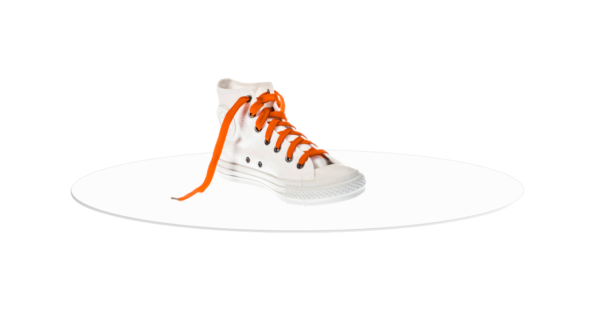 White high-top sneaker rotating on photo turntable.