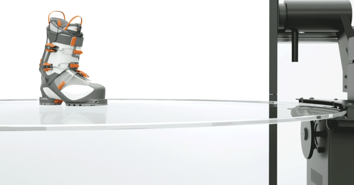 Camera photographing product on turntable plate.