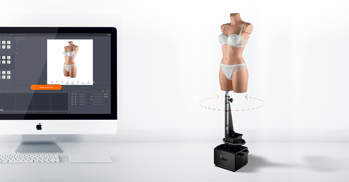 Photo editing user interface on monitor beside rotating mannequin.