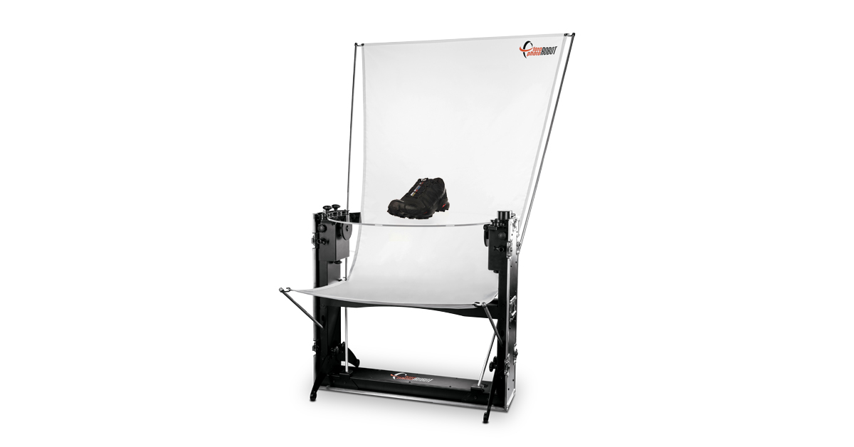 Black shoe on glass plate of photography turntable.