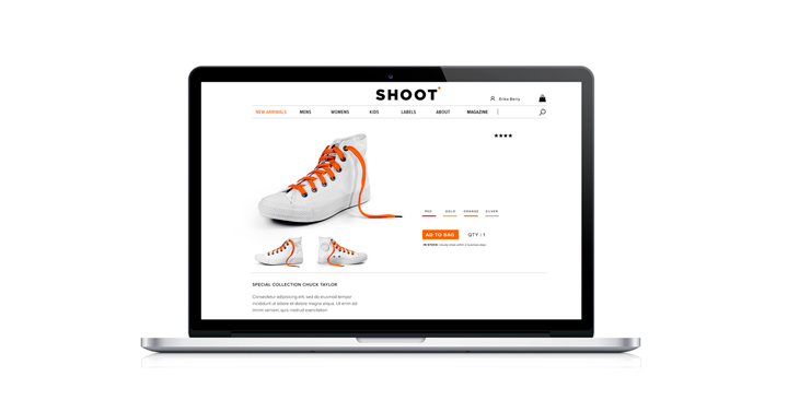 Zoom into laptop displaying shoes on screen.