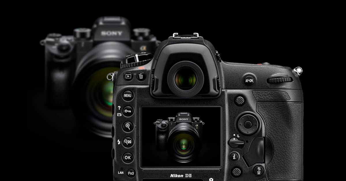 Two cameras facing each other, one zoomed into the other.