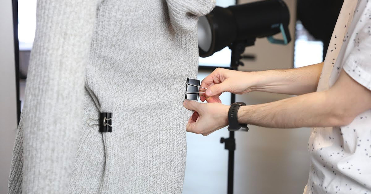 Using styling clips to hold fabric in place.