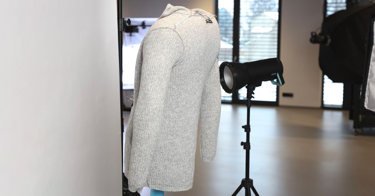 Cardigan flipped inside-out on mannequin.