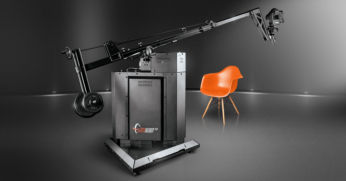 Camera mounted to arm positioned to photograph armchair.