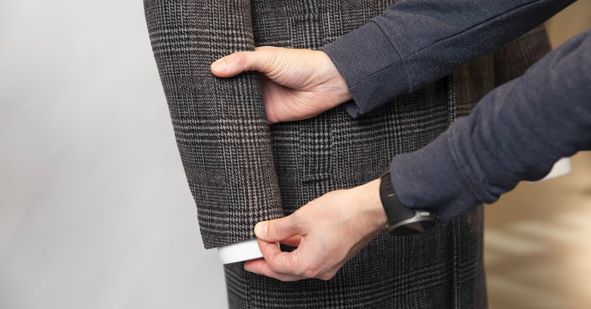 Zoom of coat sleeve with distinguishing features.