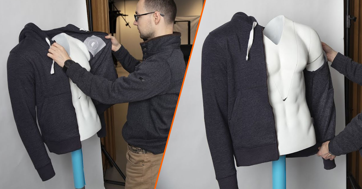 Photographer fitting sleeves onto mannequin.