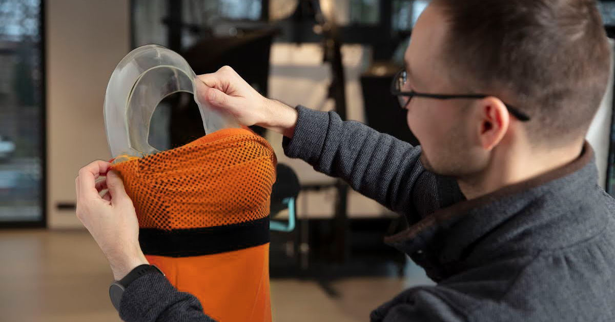 Photo of fitting the dress taut on ghost mannequin.