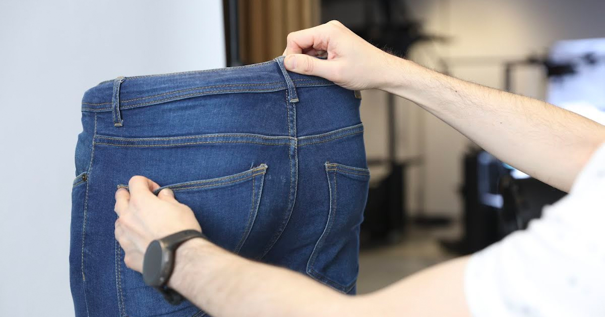 Straightening the backside of a pair of jeans.