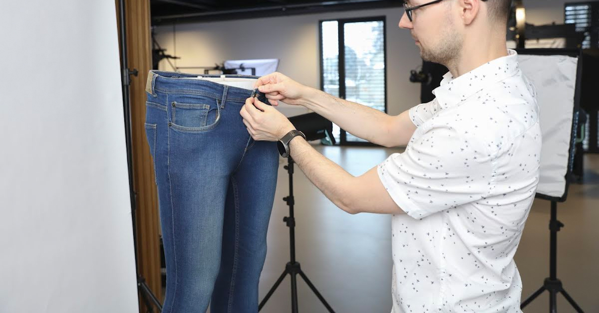Buttoning up jeans on mannequin legs.