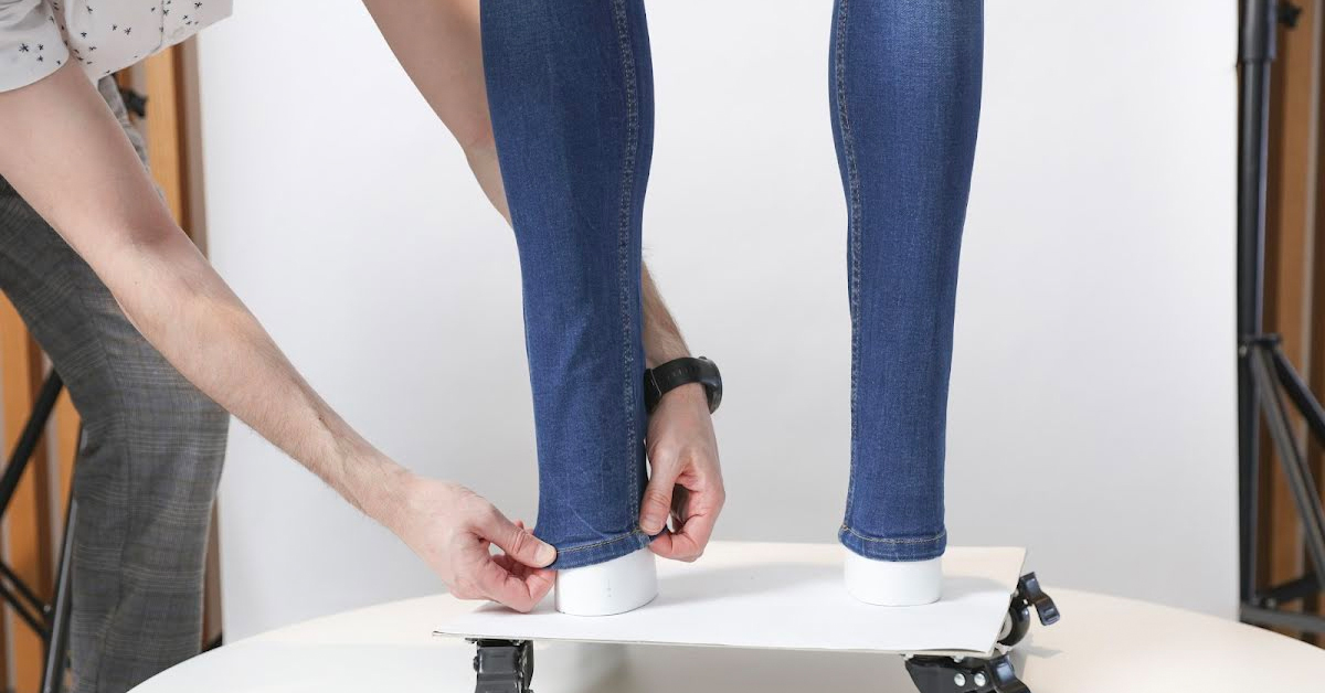 Prepping the hem-line of the jeans.