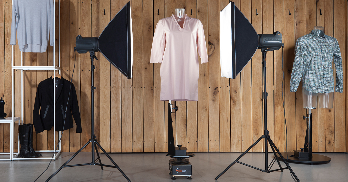 Studio setup with lights and dress on a mannequin.