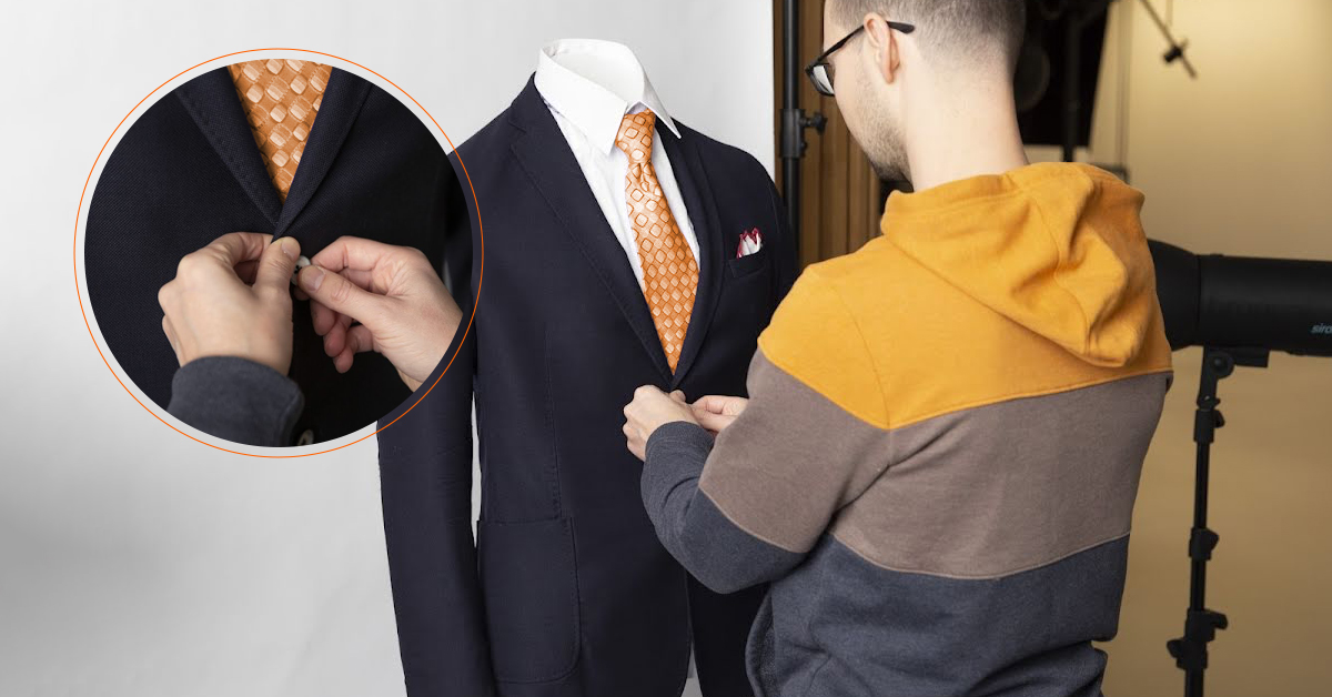 Photographer butting jacket with zoom of top button.