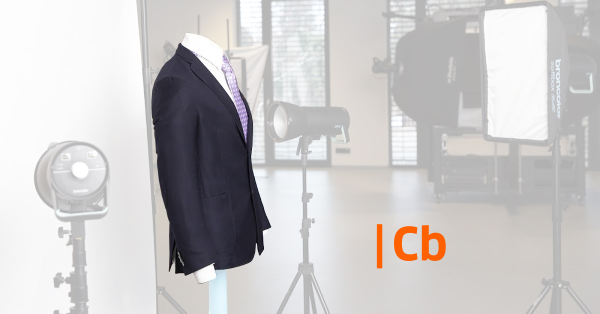 Photo studio setup with suit and tie on mannequin.