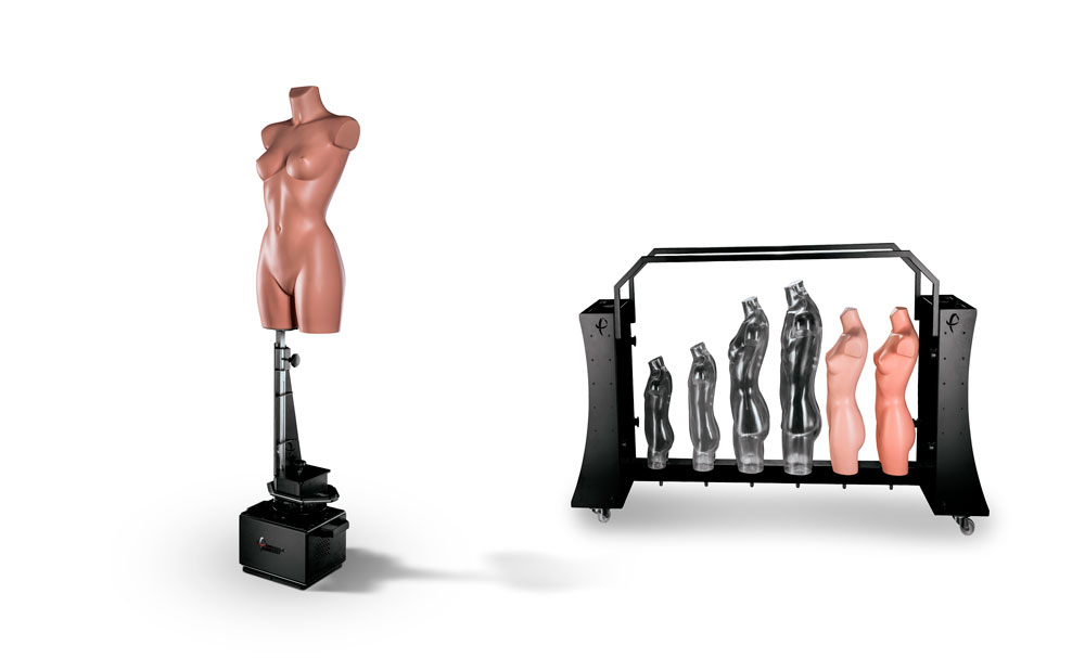 Mannequin installed on device beside storage cart of mannequins.