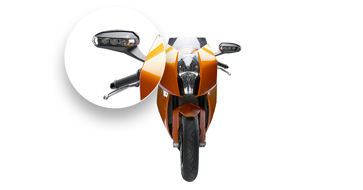 Orange motorcycle front-view beside detailed zoom. 