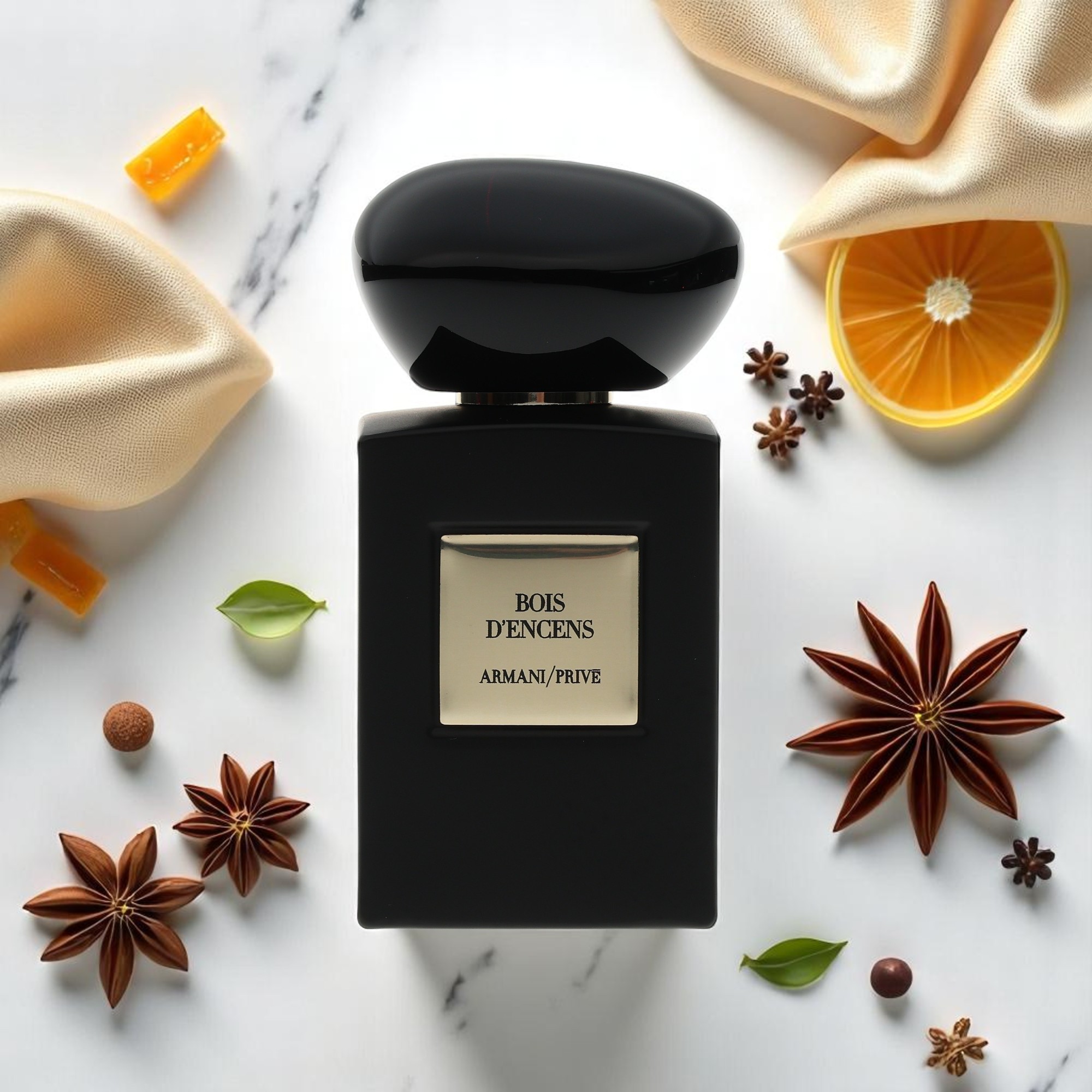 A background of fragrance ingredients compliments a product photo of Bois D’Encens by Armani/Prive.