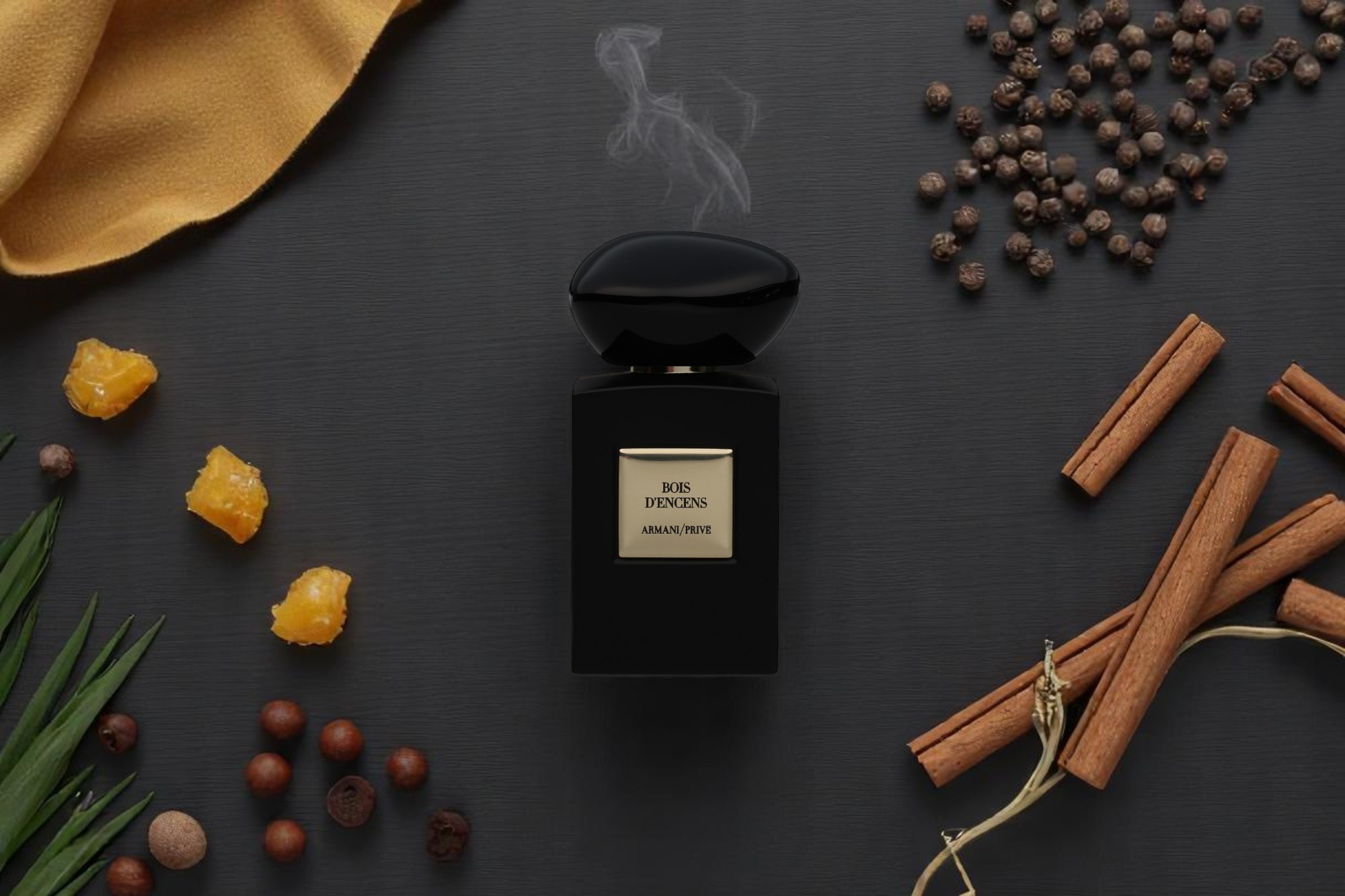 A wisp of smoke rises above the product on a background showing the perfume’s natural ingredients.
